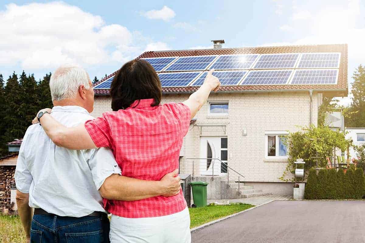 Couple with solar panels - share human stories