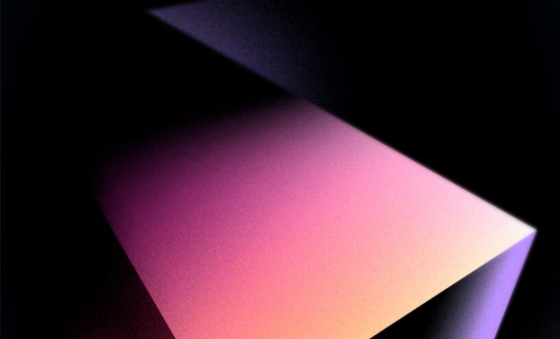 Abstract gradient light play creating a sense of dimension and depth in a dark space.